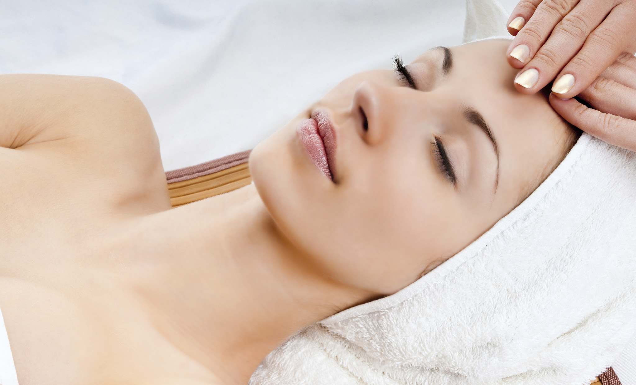 woman receiving facial massage